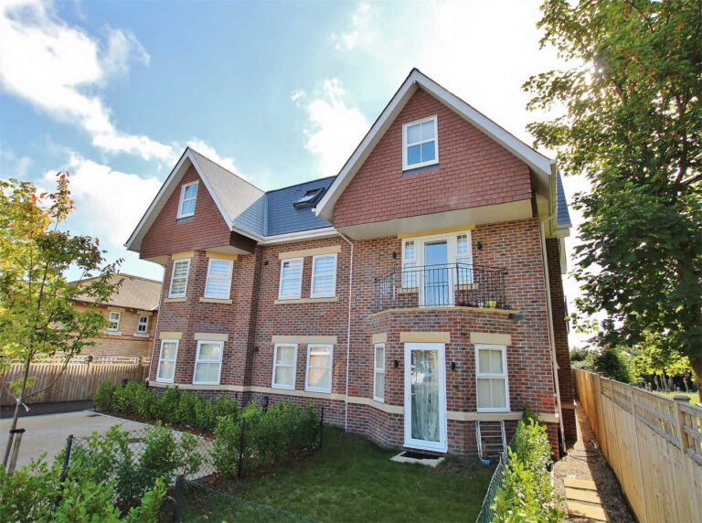 Exterior of a block of 8 large new build apartments in a traditionally-styled building, close to Poole Town Centre - a construction project by Baron.