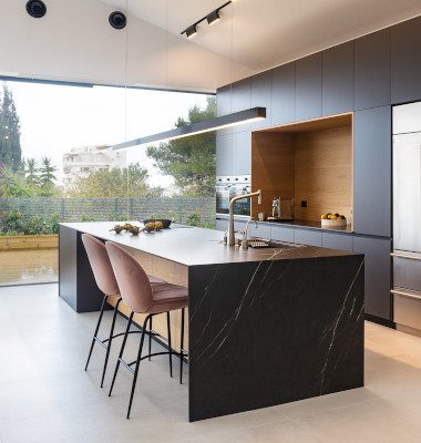 Modern refurbished kitchen with island dining area.